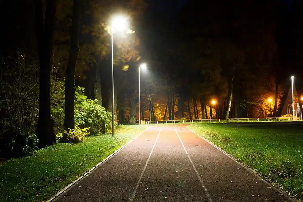 LED streetlights illuminating a modern urban street at night - sustainable outdoor lighting