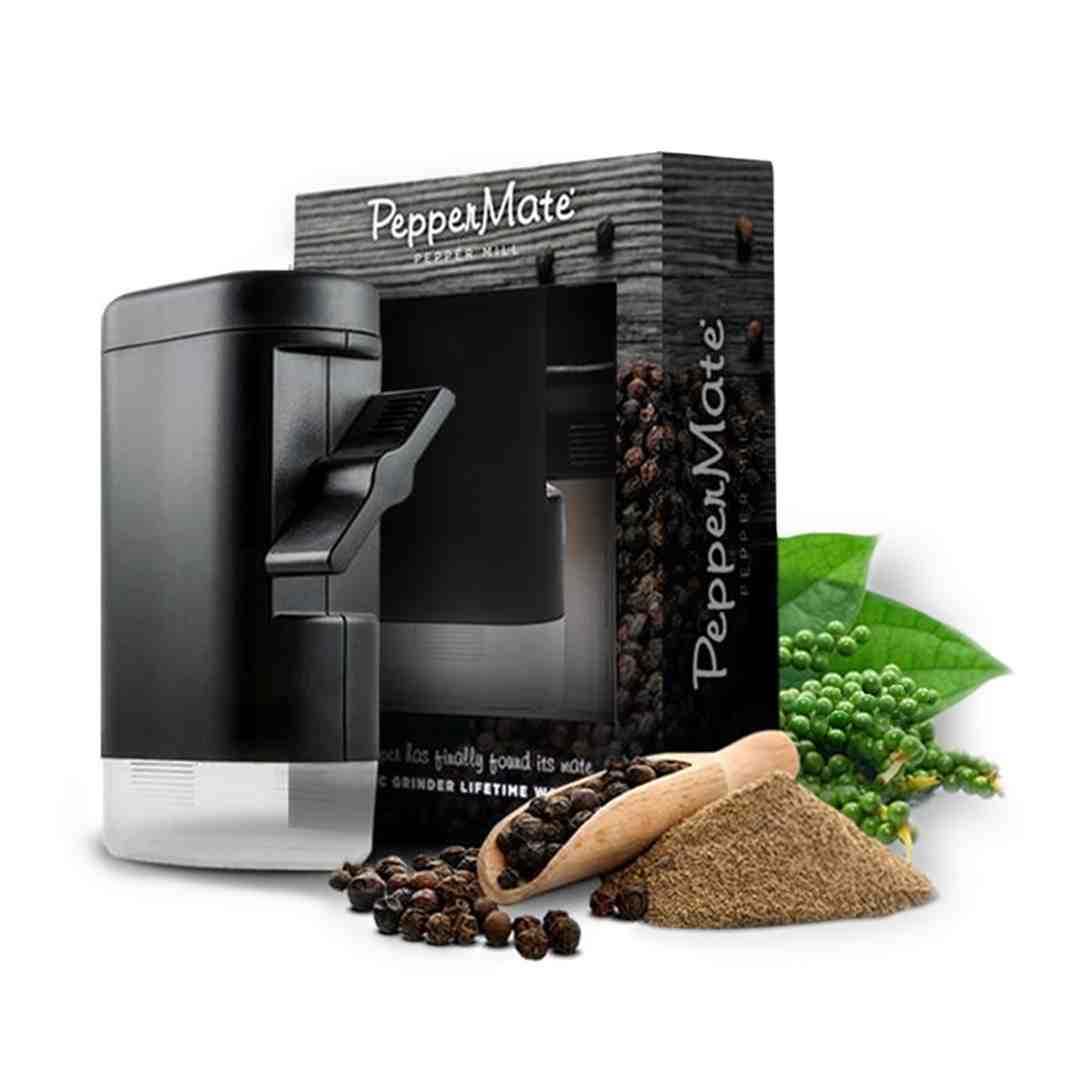 assortment of whole spices and a ceramic grinder in a modern kitchen - ceramic spice grinders