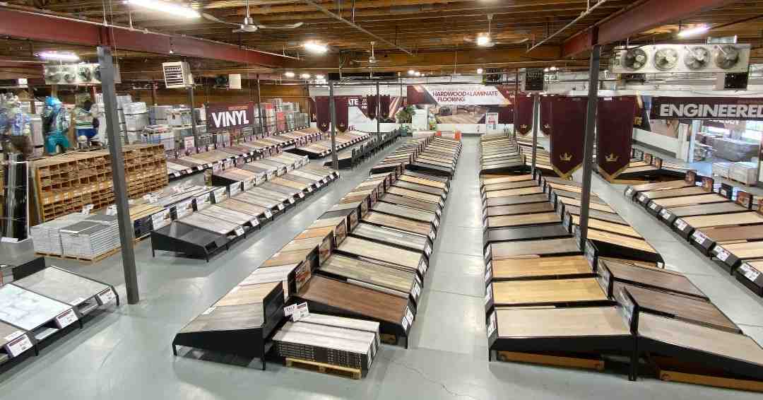 Expansive King of Floors showroom with vast displays of flooring, including large laminate samples, showcasing the wide selection available for customers. - top laminate flooring
