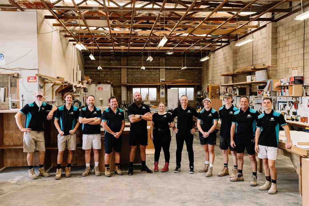 The G&M Craftsman team of joinery and cabinet experts standing inside their workshop on the Sunshine Coast.