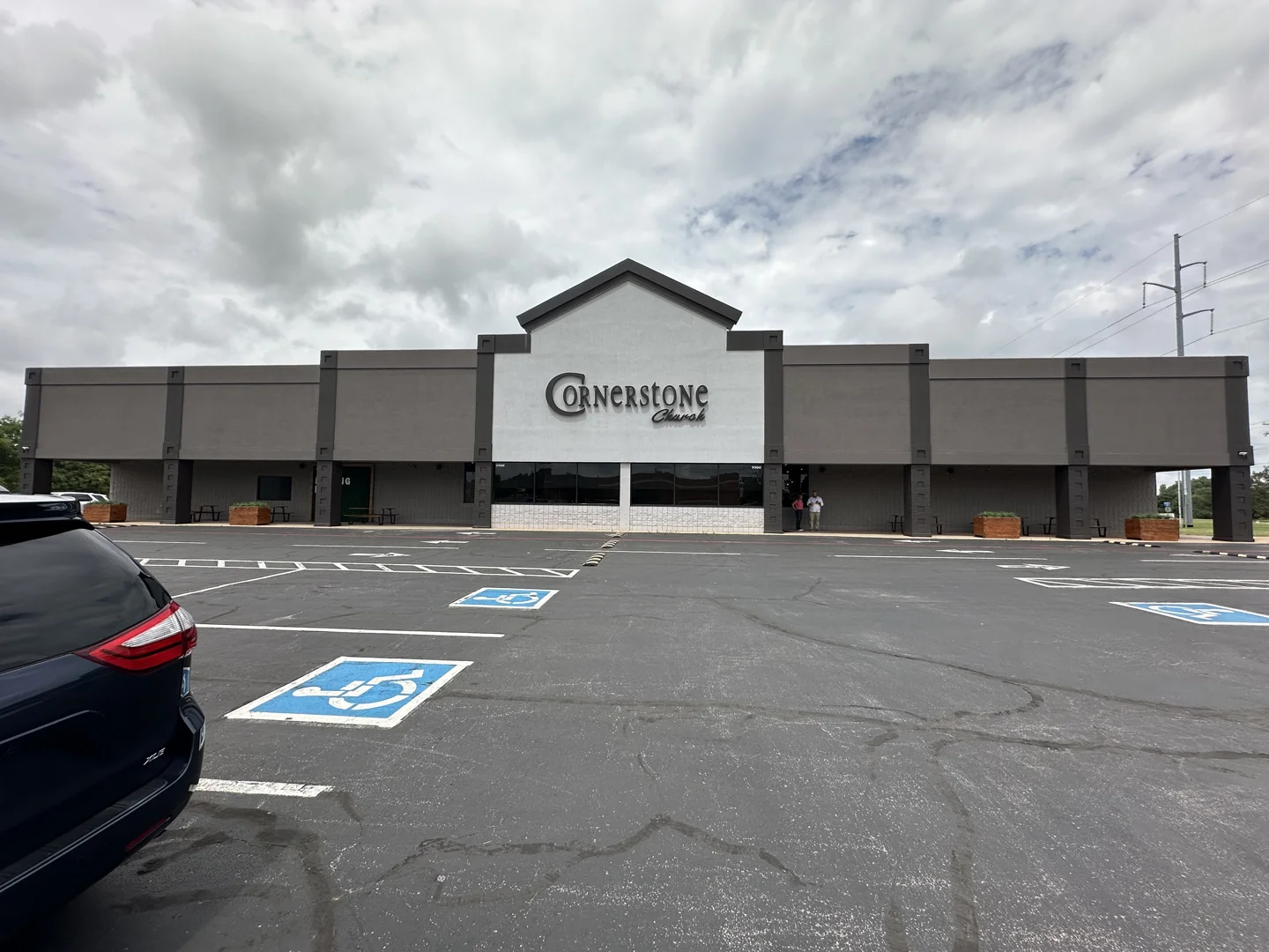 user-inserted Cornerstone Church exterior facade renovation, showcasing improved visibility and a welcoming entrance.