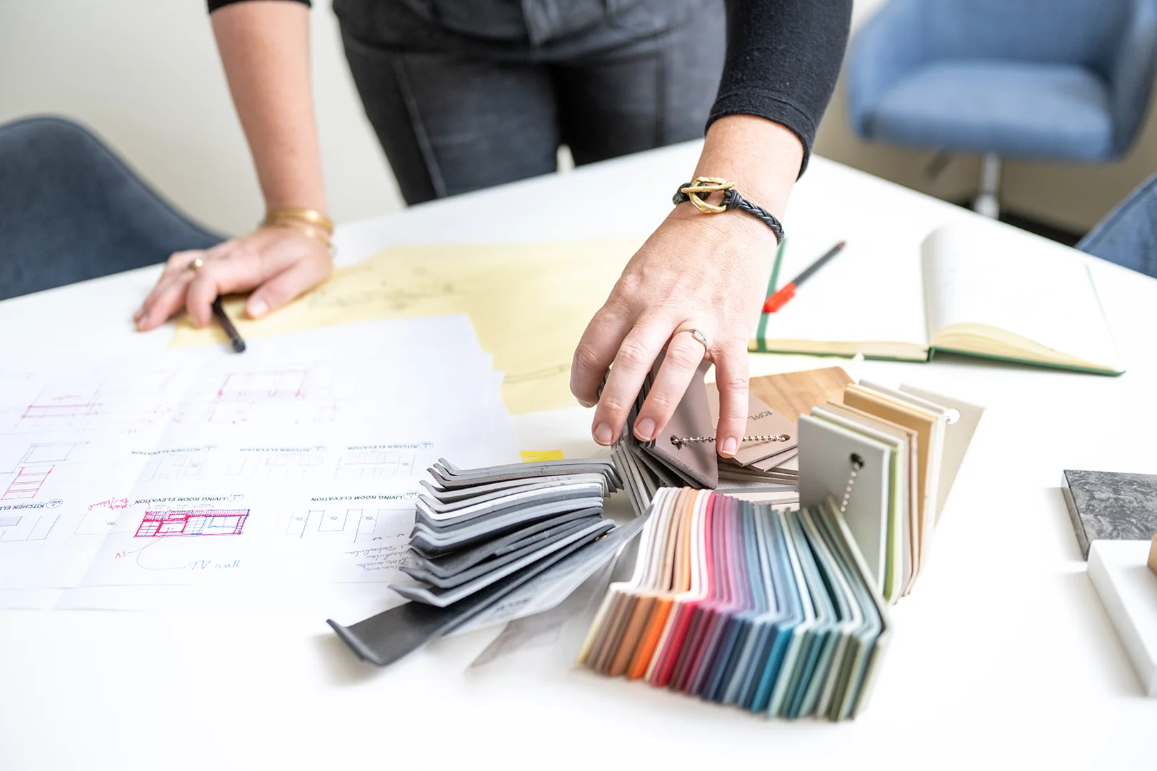 commercial architect reviewing building plans on site - what it costs to hire a commercial architect