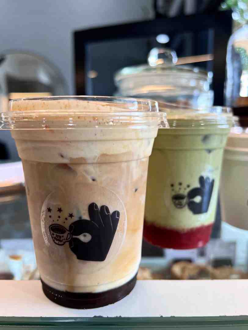 Japanese matcha latte garnished with fresh ginger and citrus