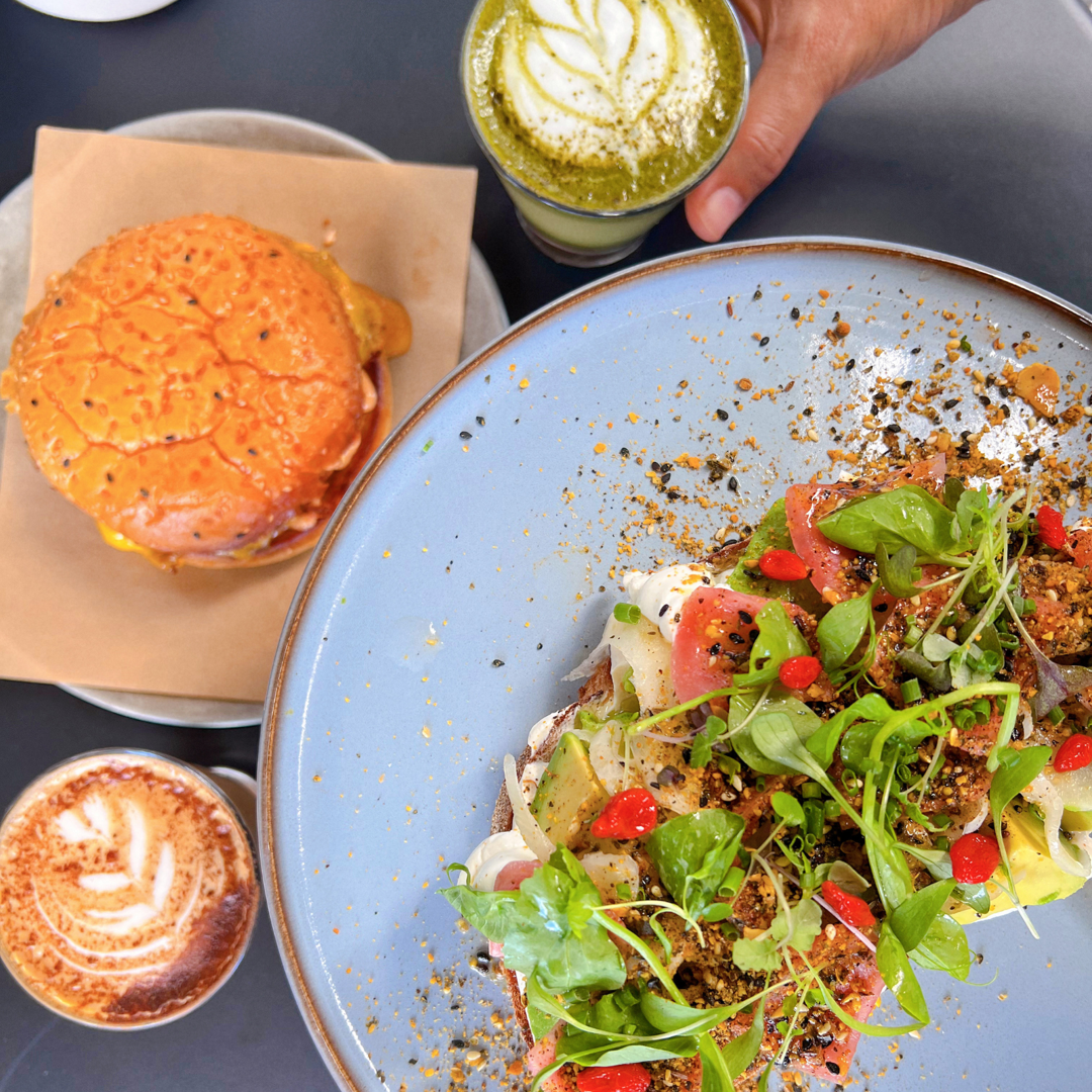 The vibrant Chilli Scramble dish, perfectly plated on sourdough toast with feta and pickled peppers, ready to be enjoyed at Flinders Lane Cafe - morning coffee spot