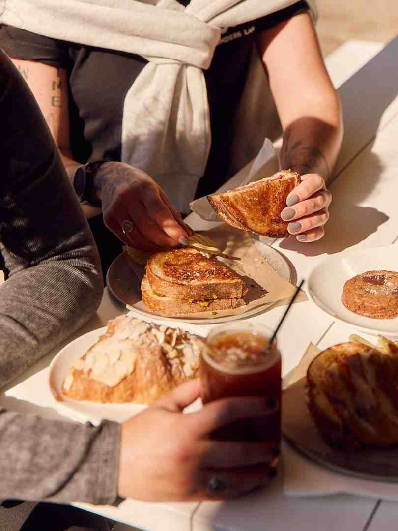 infographic showing coffee shop food categories from breakfast classics to signature dishes and drink pairings infographic