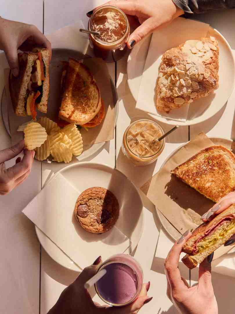 Flinders Lane Cafe: Reubens, veggie sandos, almond croissants, and cookies, a perfect brunch date spot.