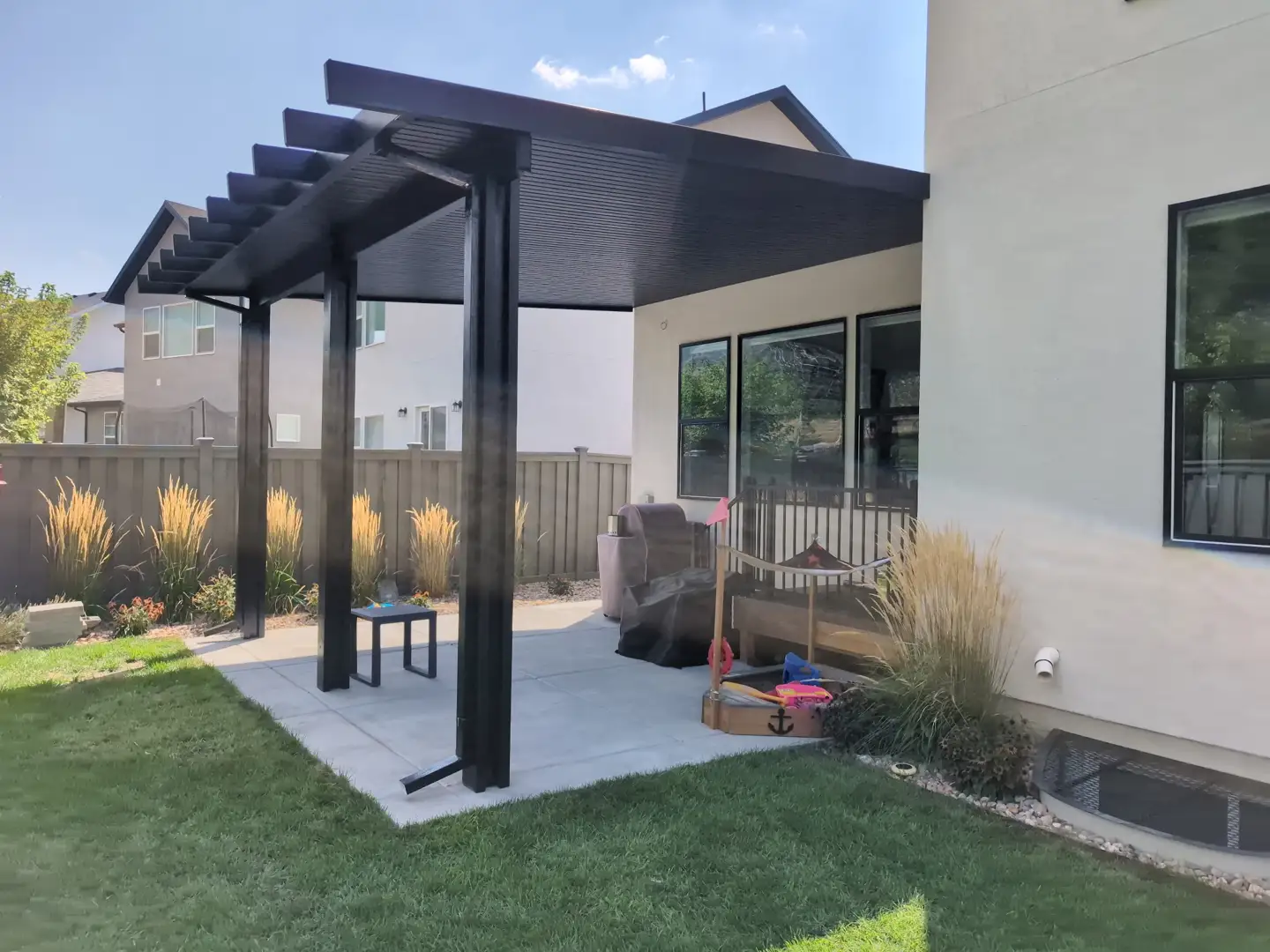 showing a side-by-side comparison of a fixed awning and a retracted awning on similar homes. - entrance covers awnings showing a side-by-side comparison of a fixed awning and a retracted awning on similar homes. - entrance covers awnings