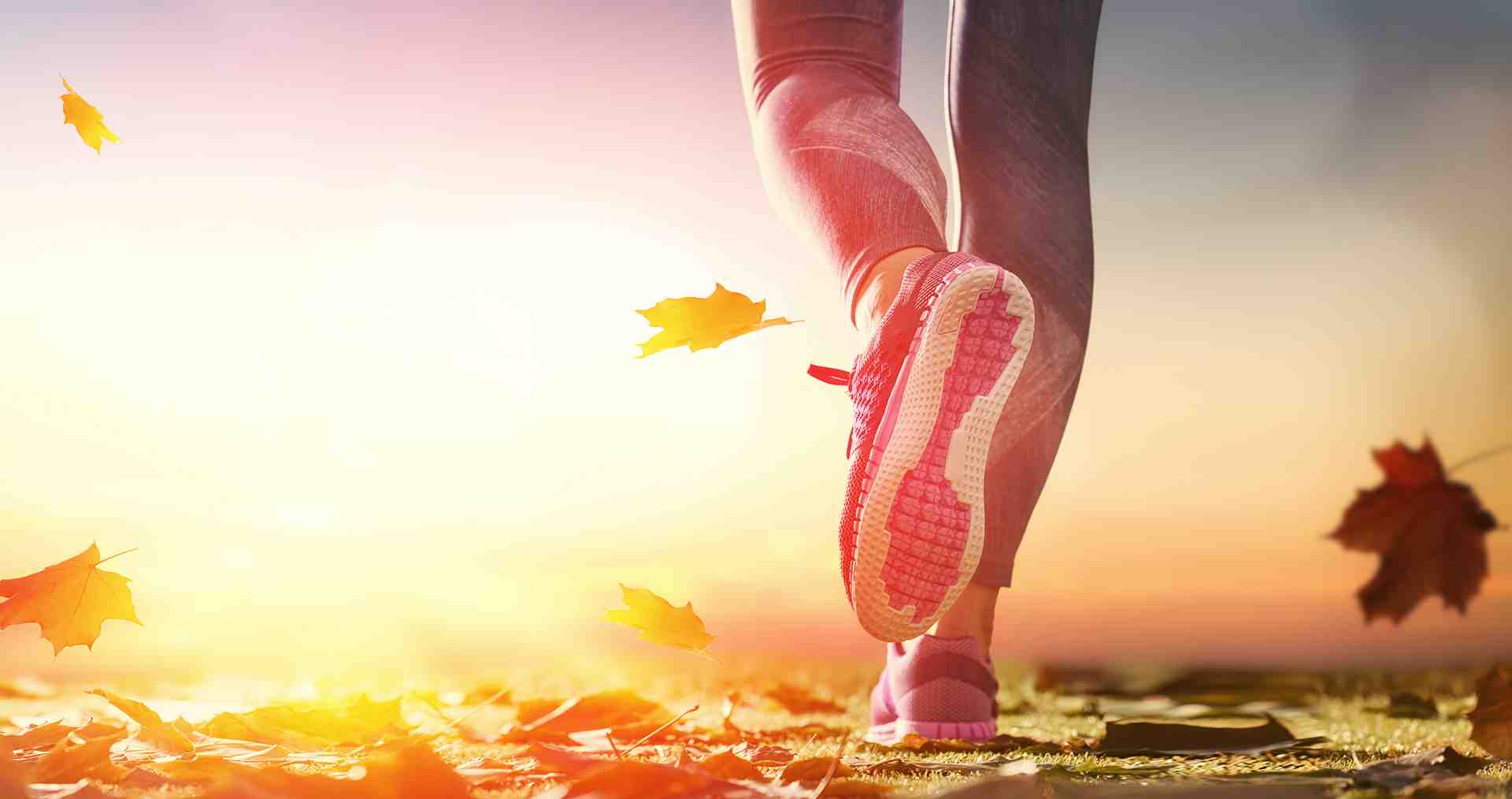 Active woman enjoying a peaceful outdoor walk on an autumn trail