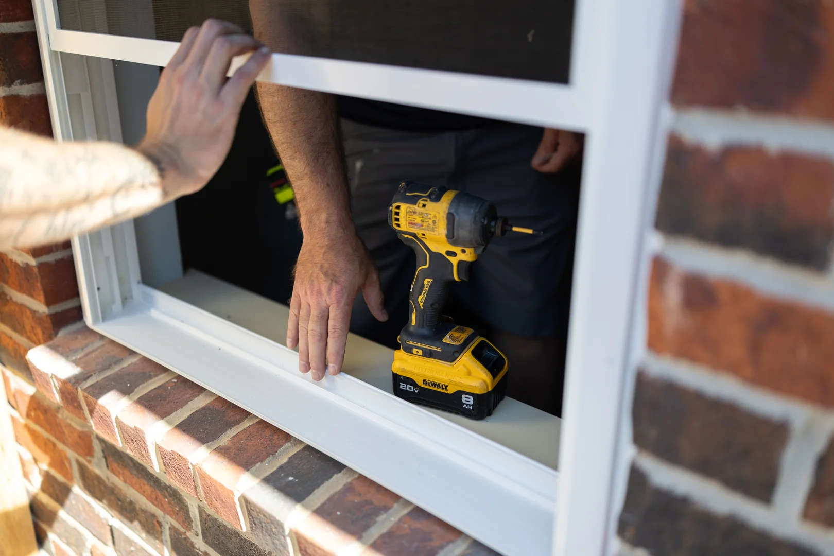 A professional technician performing a custom window installation
