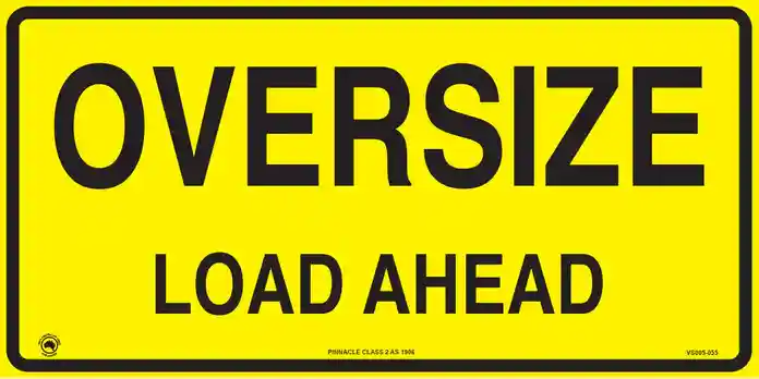 Australian road warning construction vehicle sign advising drivers of an oversize load ahead necessitating cautious driving around the heavy haulage route.