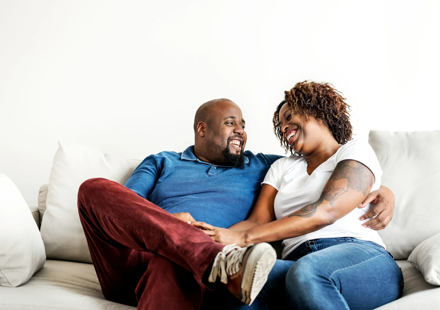 couple discussing their relationship in a bright Barcelona apartment, looking thoughtful but hopeful couple discussing their relationship in a bright Barcelona apartment, looking thoughtful but hopeful