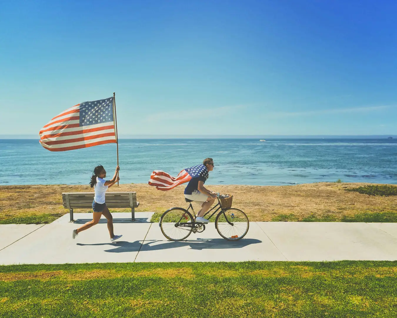 American expats enjoying a bicycle ride along the beach American expats enjoying a bicycle ride along the beach