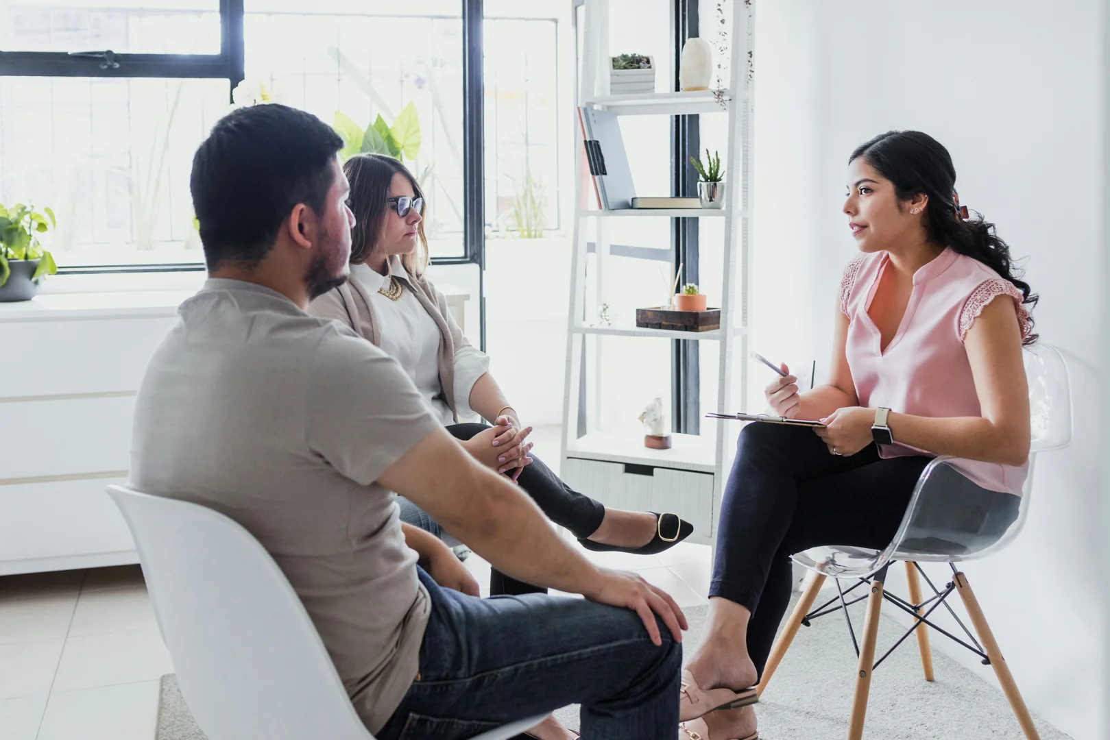 A couple discussing their relationship with a therapist A couple discussing their relationship with a therapist
