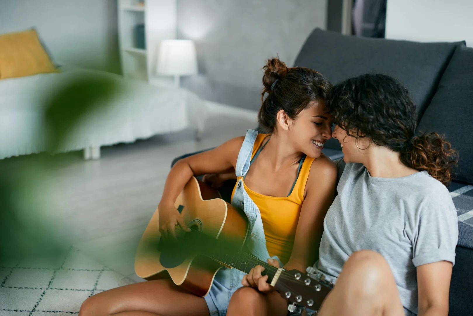 A couple sitting together, happily singing and listening, representing their shared dreams and future aspirations. - marital therapy exercises