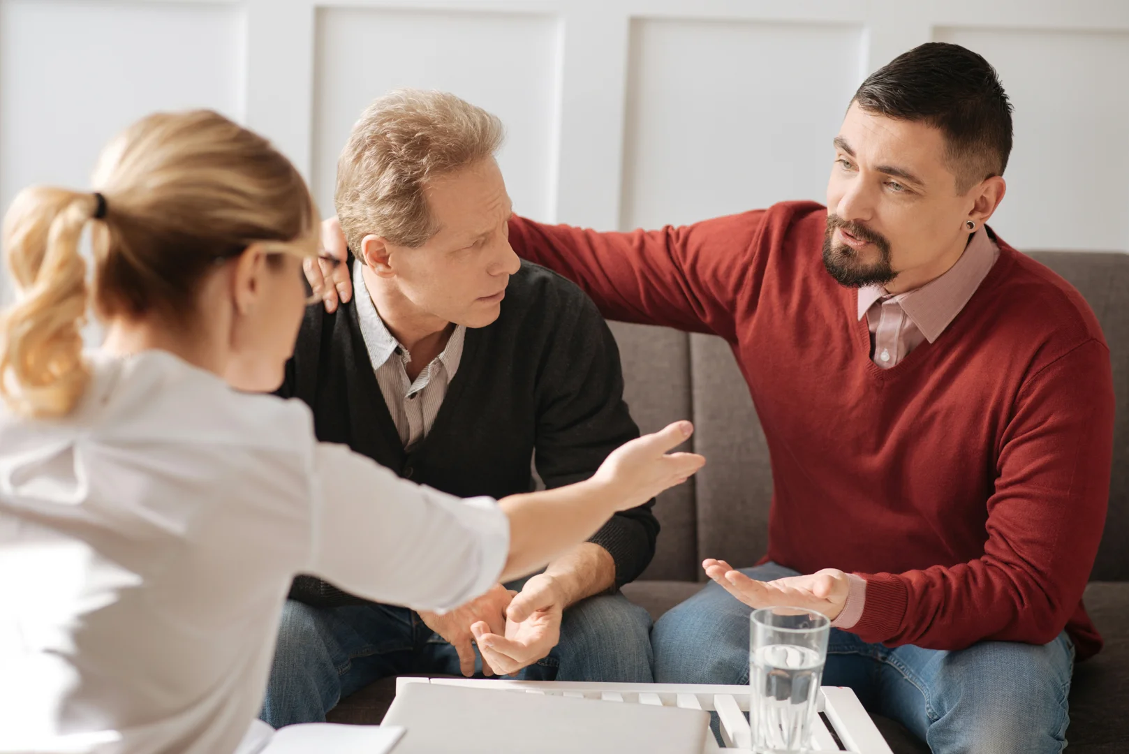 A warm, inviting, and inclusive therapy office with comfortable seating and soft lighting, designed to feel safe and welcoming for diverse individuals - lgbtq couples counseling