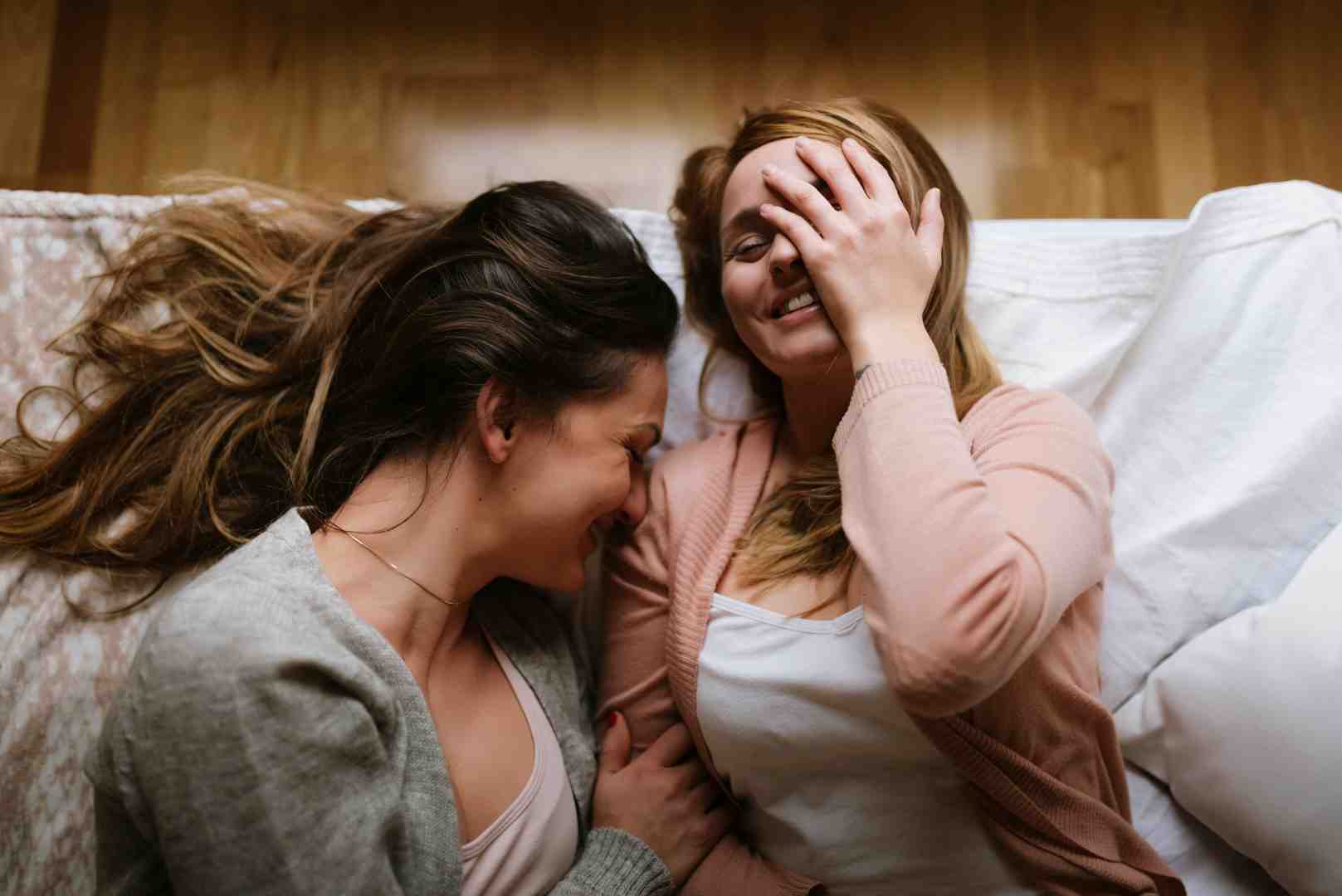 Lesbian couple laughing together. Lesbian couple laughing together.