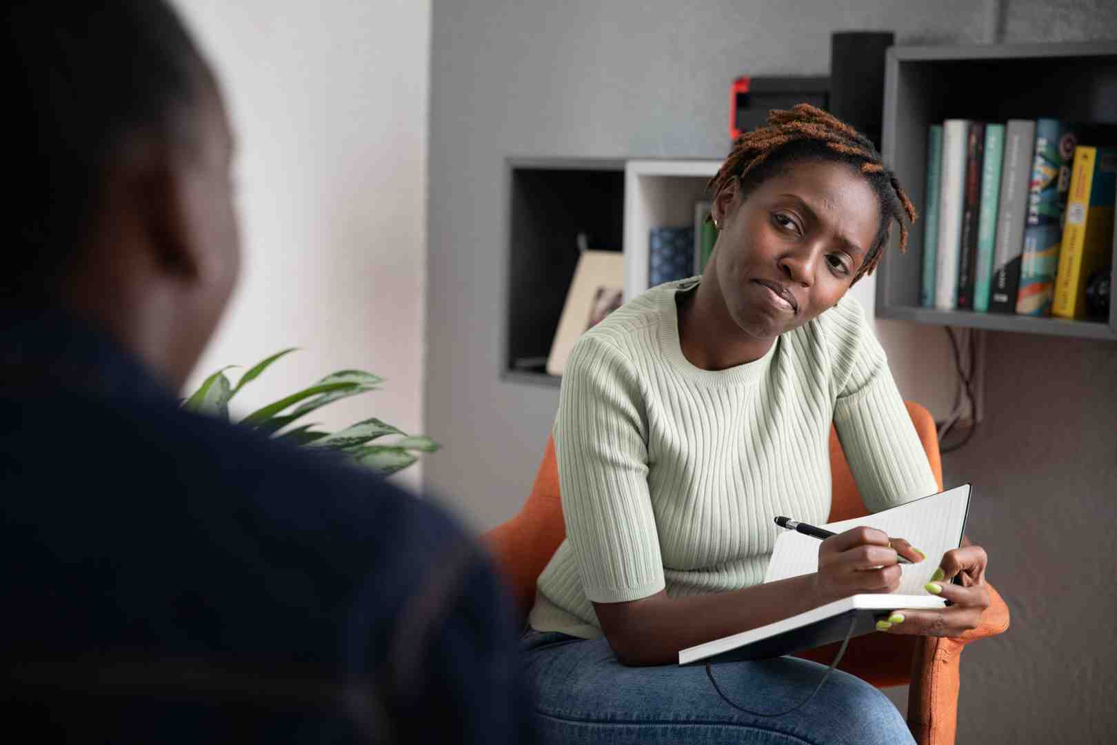 two people in a collaborative, positive conversation in a therapy setting - solution focused therapy for adjustment disorder