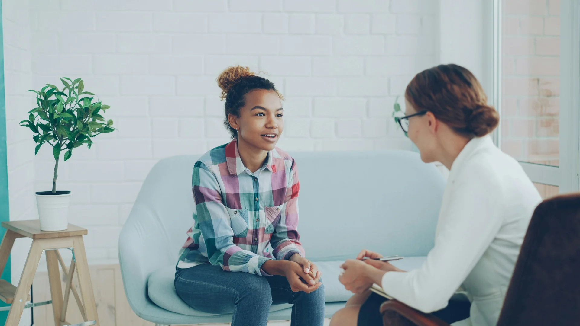 teenage therapy session warm professional environment adolescent mental health support