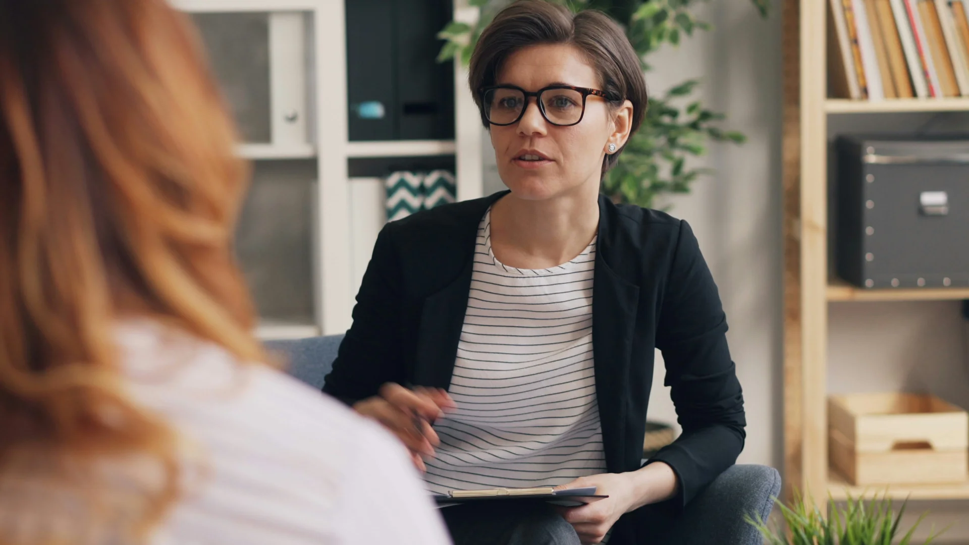 person reflecting during a therapy session in a warm professional environment person reflecting during a therapy session in a warm professional environment