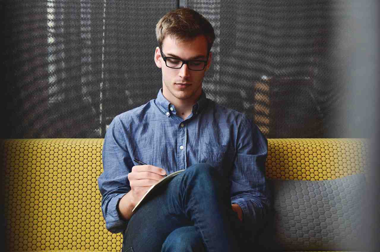 Person at desk turning messy data into clear plan - social media kpi benchmarks
