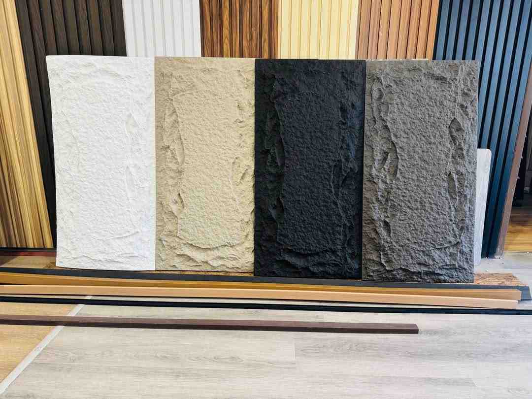 Samples of textured stone cladding in white, beige, black, and grey, demonstrating a variety of aesthetic options for a highly cladded home. Samples of textured stone cladding in white, beige, black, and grey, demonstrating a variety of aesthetic options for a highly cladded home.
