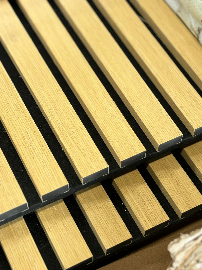 Detailed view of a fluted WPC cladding texture sample, highlighting the realistic timber grain and contemporary design.