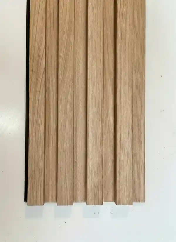 Close-up of blonde oak slatted acoustic panel, a modern type of timber indoor cladding perfect for contemporary home office designs Close-up of blonde oak slatted acoustic panel, a modern type of timber indoor cladding perfect for contemporary home office designs