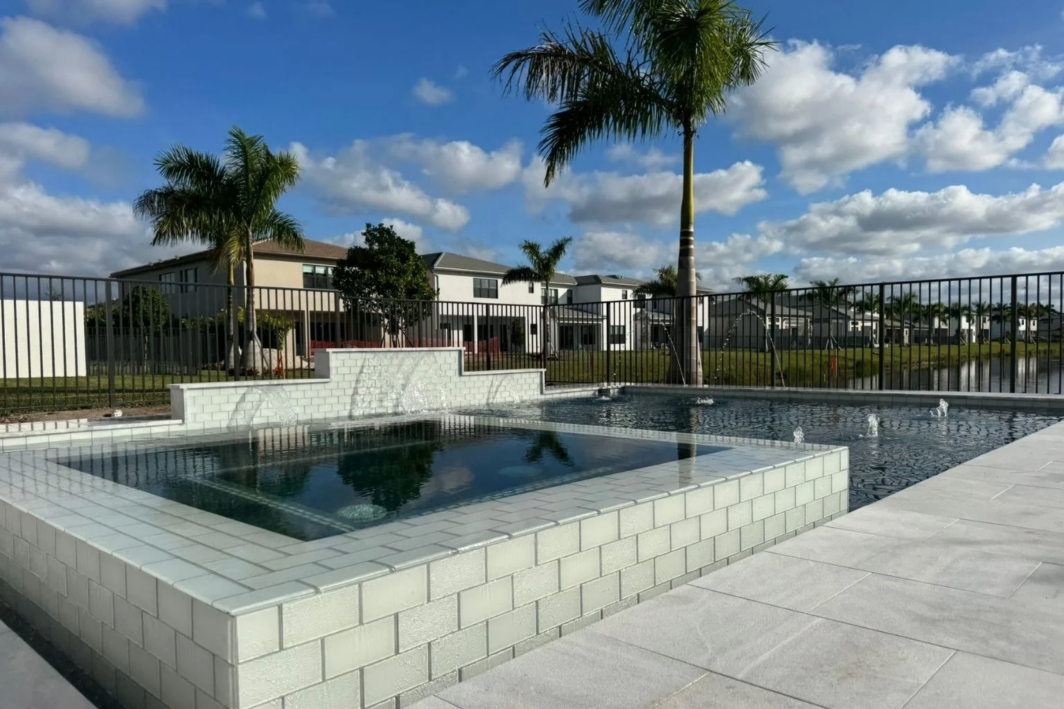 Florida luxury pool with sandbags for hurricane preparation