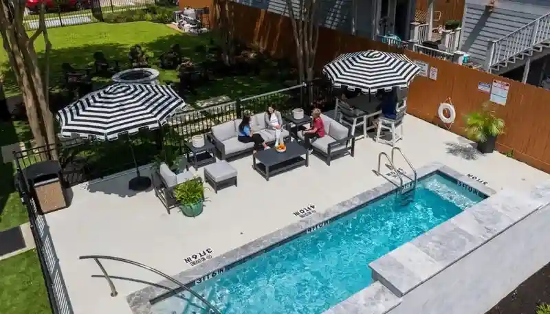 Black Horse Health facility amenities, featuring a pool and outdoor lounge -  Black Horse Health