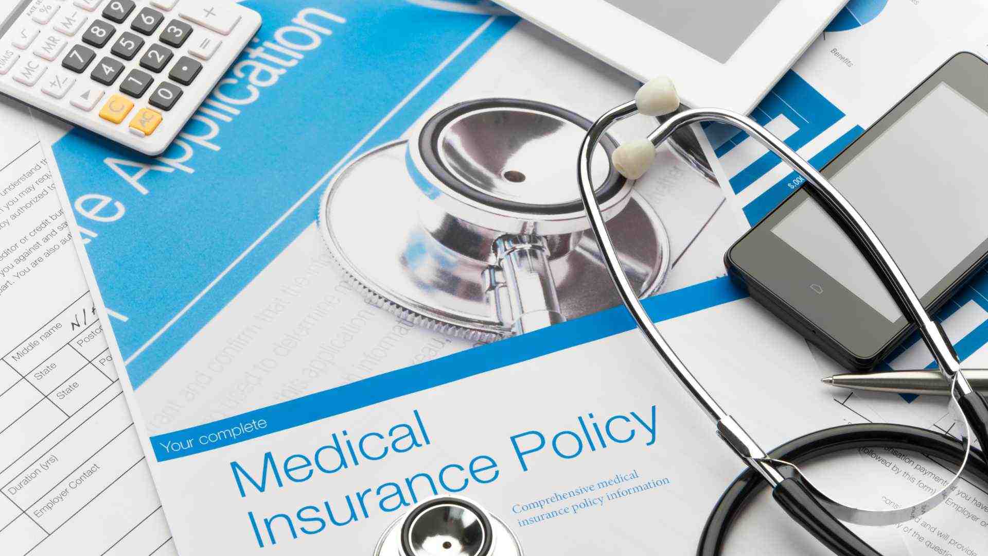 A person reviewing insurance documents with a financial advisor - Drug & Alcohol Rehabs in Evansville, Indiana