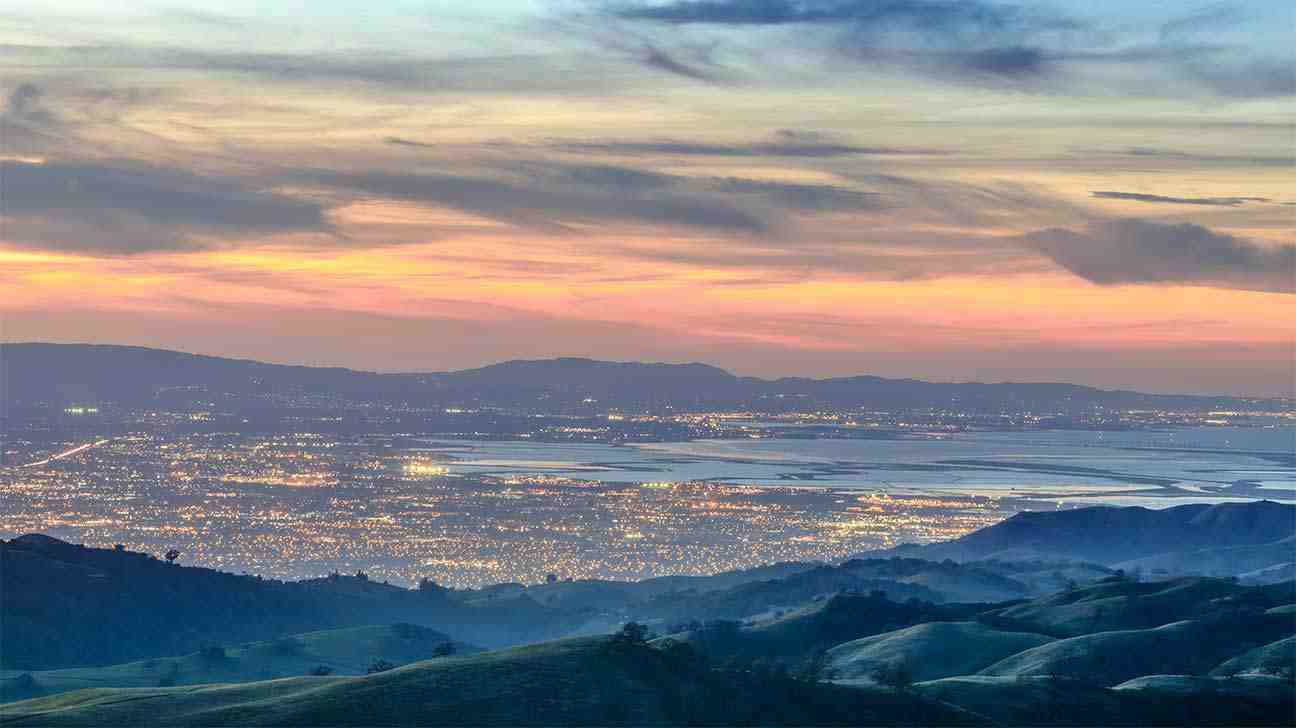 A vibrant sunrise over a tranquil California landscape, symbolizing new beginnings and hope. - addiction and rehab hotlines/california numbers