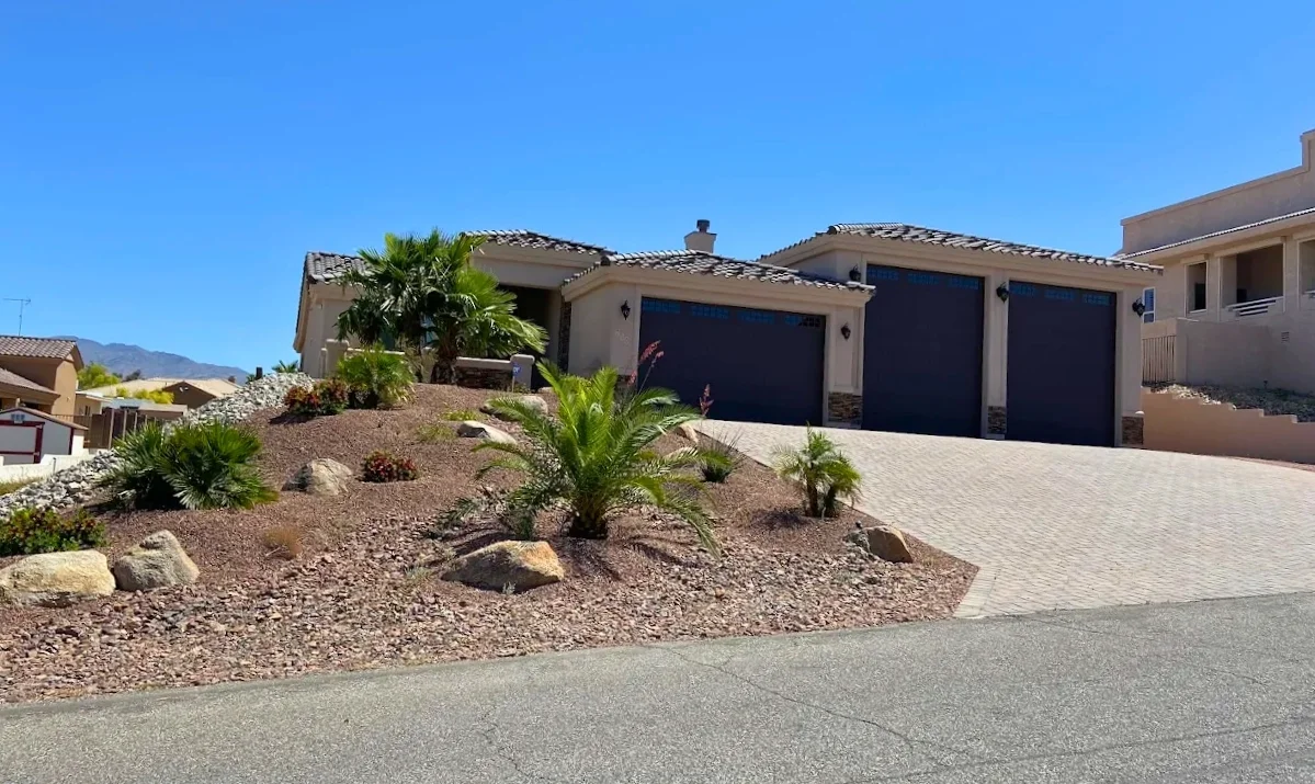 professionally finished Arizona desert landscape with decorative rock boulders desert plants and hardscape