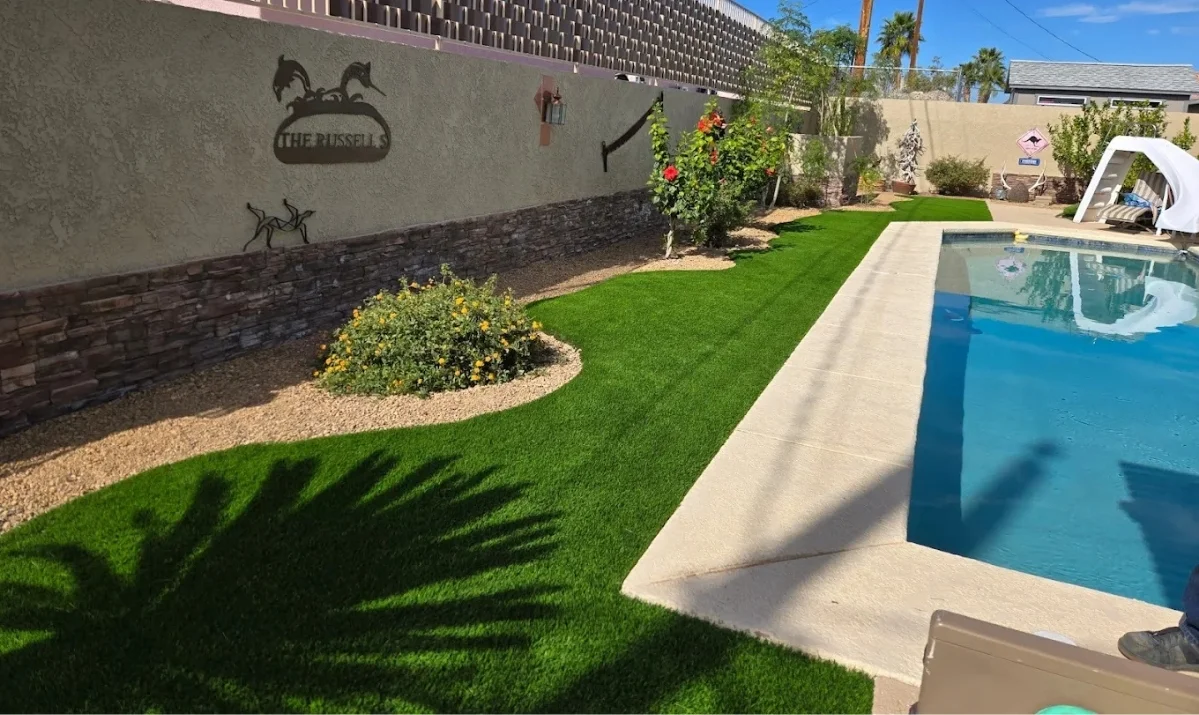 finished luxury desert backyard with paver patio shade seating and desert landscaping