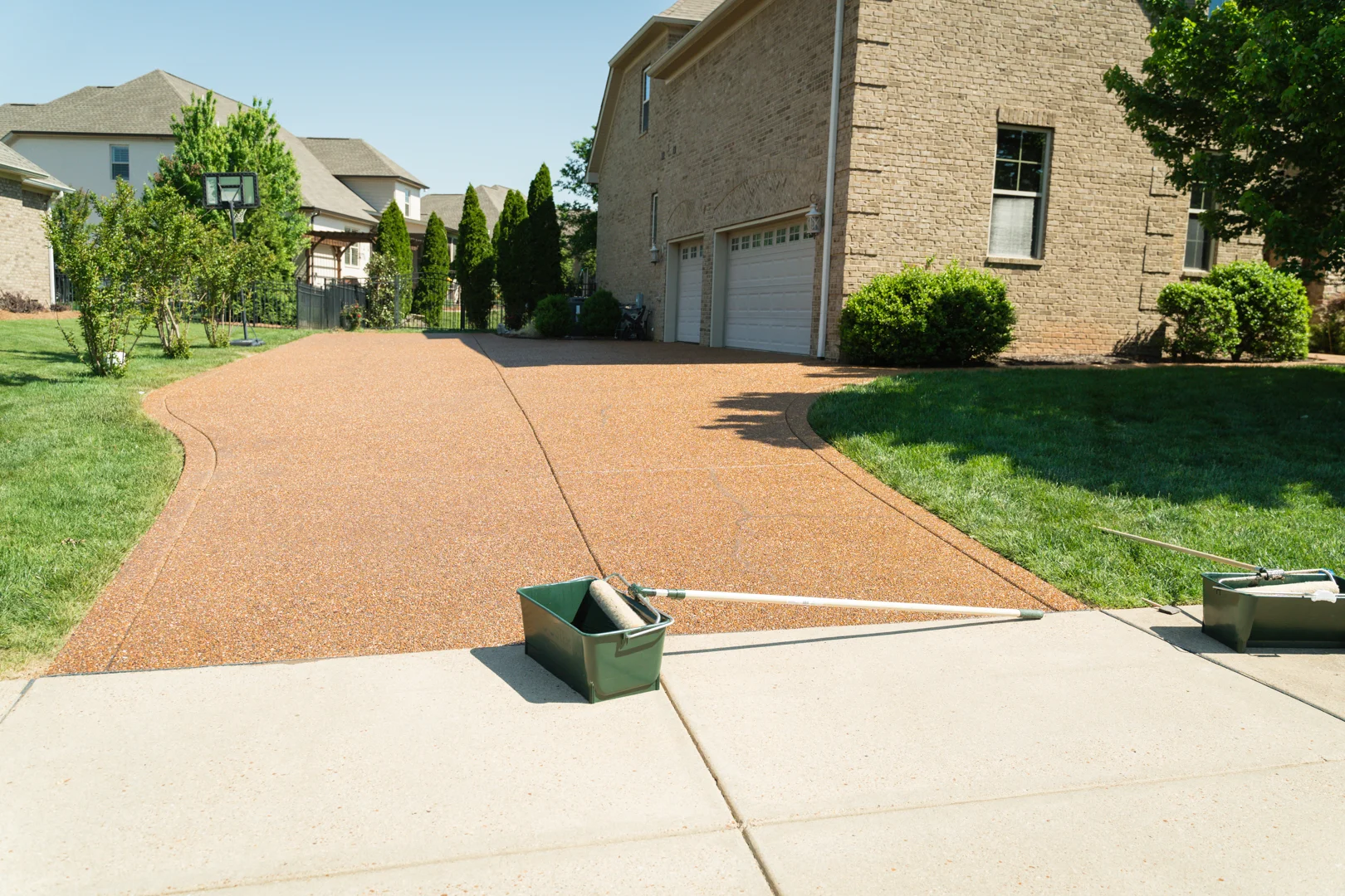 Comparison between a freshly sealed dark asphalt driveway and a cracked, gray unsealed surface Comparison between a freshly sealed dark asphalt driveway and a cracked, gray unsealed surface