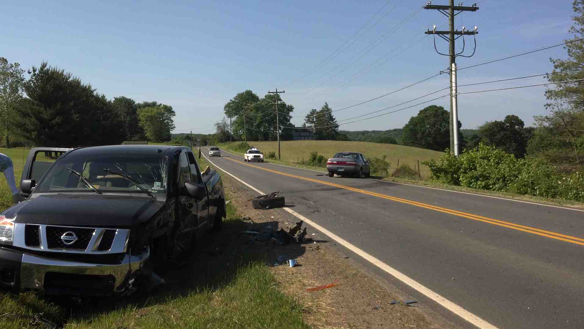 Image of a police officer taking notes at an accident scene - Orange truck accident lawyer