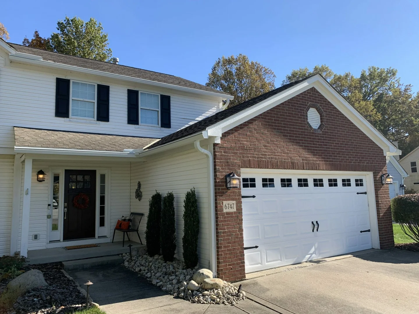 A multi-story Columbus home with complex rooflines and multiple gables - gutter installation cost Columbus Ohio