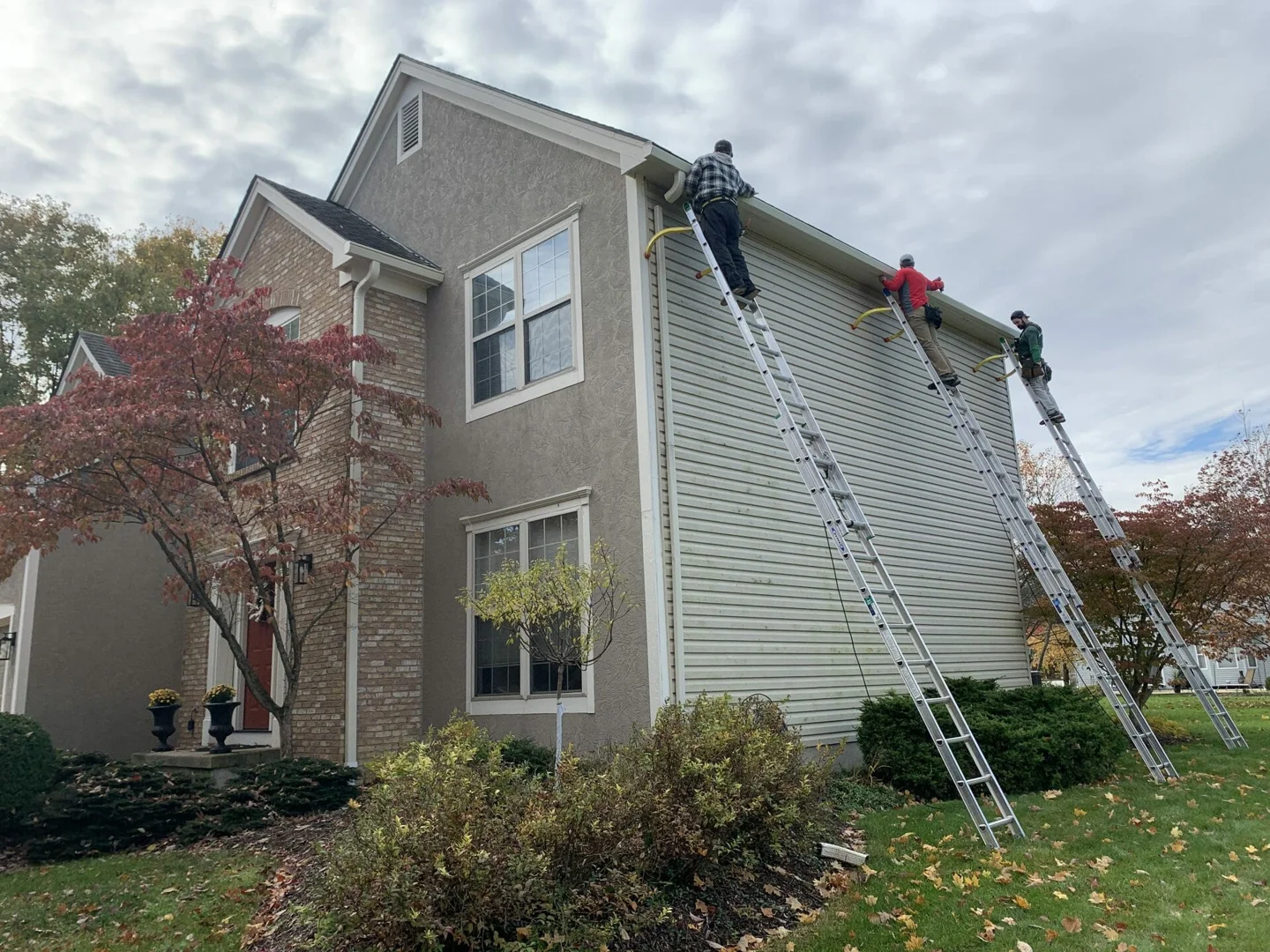 High-performance gutter guards being installed on a seamless system - gutter installation cost Columbus Ohio