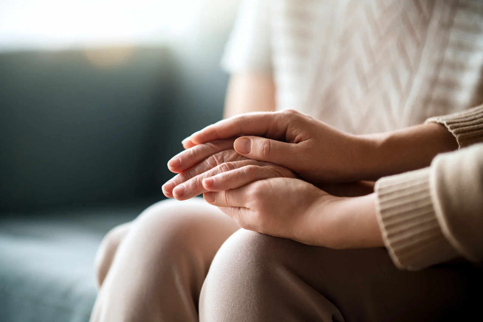 a close up with a hand comforting another showing a high-functioning depression therapist help a client a close up with a hand comforting another showing a high-functioning depression therapist help a client