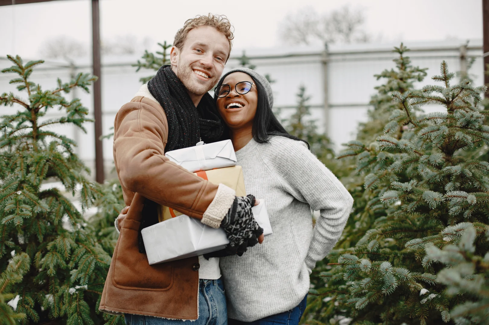 A happy mixed race couple shopping for gifts on chrismas-couples therapy burnout recovery