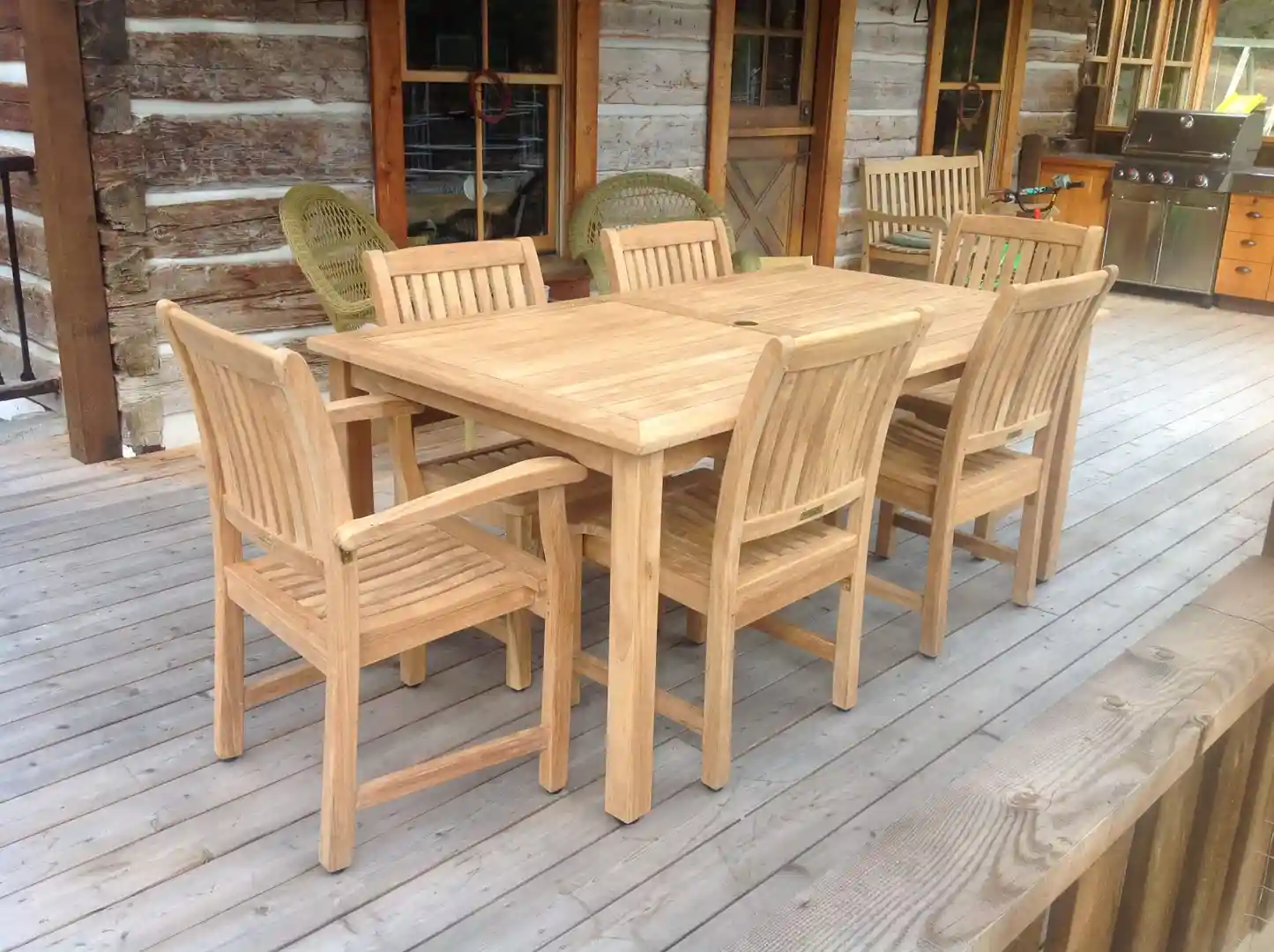 Goldenteak dining set on a lawn, ready for a summer barbecue - teak outdoor Massachusetts