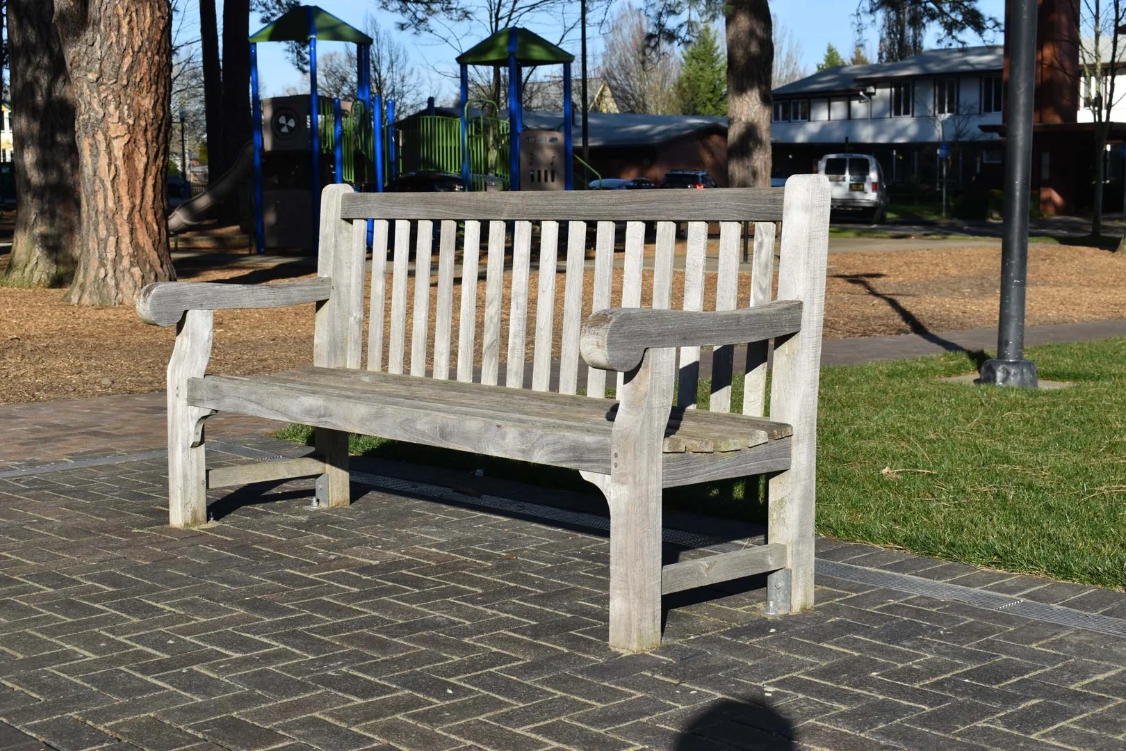 Classic teak bench positioned in a beautifully landscaped Massachusetts garden setting - Buy teak garden furniture Classic teak bench positioned in a beautifully landscaped Massachusetts garden setting - Buy teak garden furniture