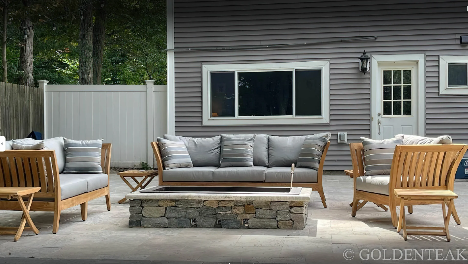 Goldenteak Teak Deep Seating Club Chair on a porch - oversized patio chair