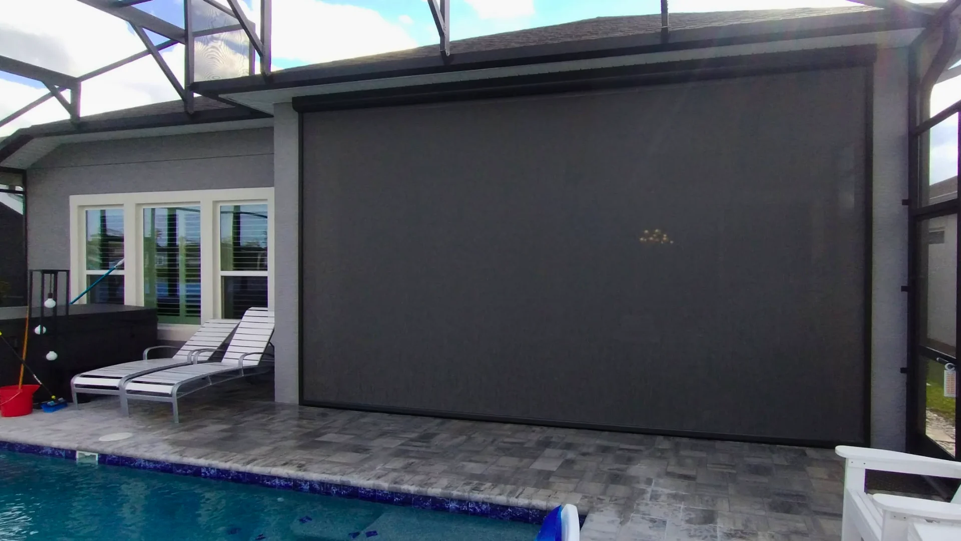 motorized storm screens on a Florida lanai patio motorized storm screens on a Florida lanai patio