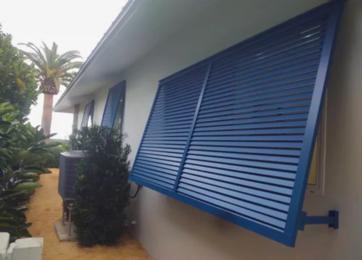 A completed residential home featuring custom-fit Bahama shutters A completed residential home featuring custom-fit Bahama shutters