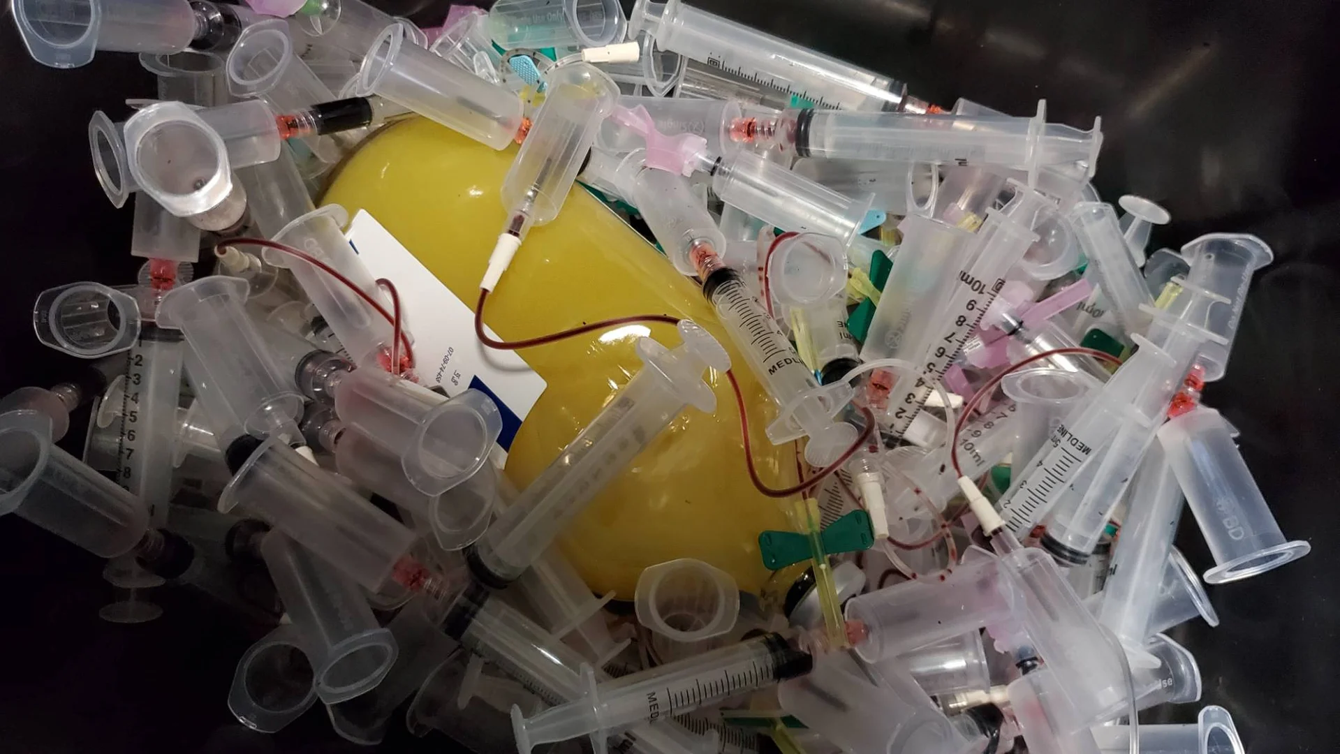 healthcare professional disposing of medical materials - pharmaceutical waste healthcare professional disposing of medical materials - pharmaceutical waste