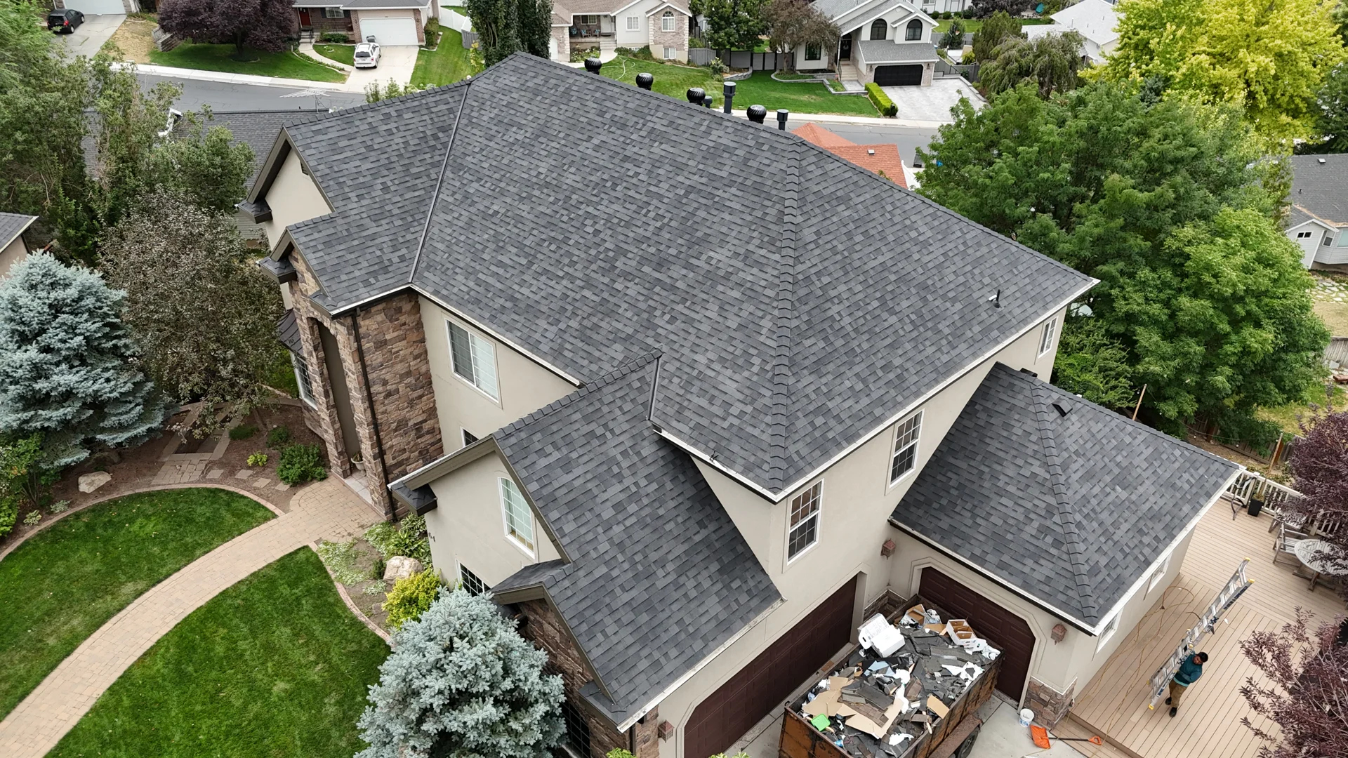 Homeowner using binoculars for a ground-level roof check - affordable roof maintenance Homeowner using binoculars for a ground-level roof check - affordable roof maintenance