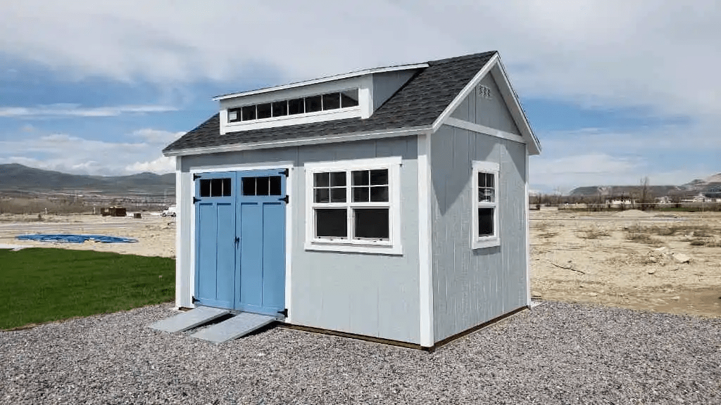 A shed with a blue entry ramp, showcasing easy access. Focus on shed entry ramp solutions.