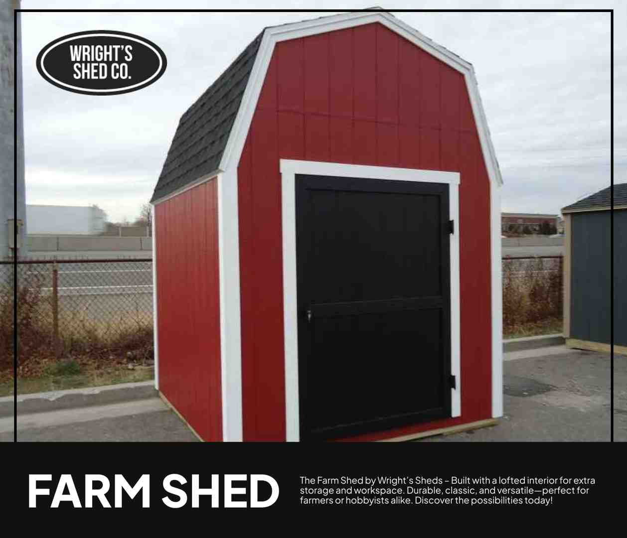 Red barn-style farm shed with white trim, black door, and a lofted roof for extra storage, photographed on a display lot.