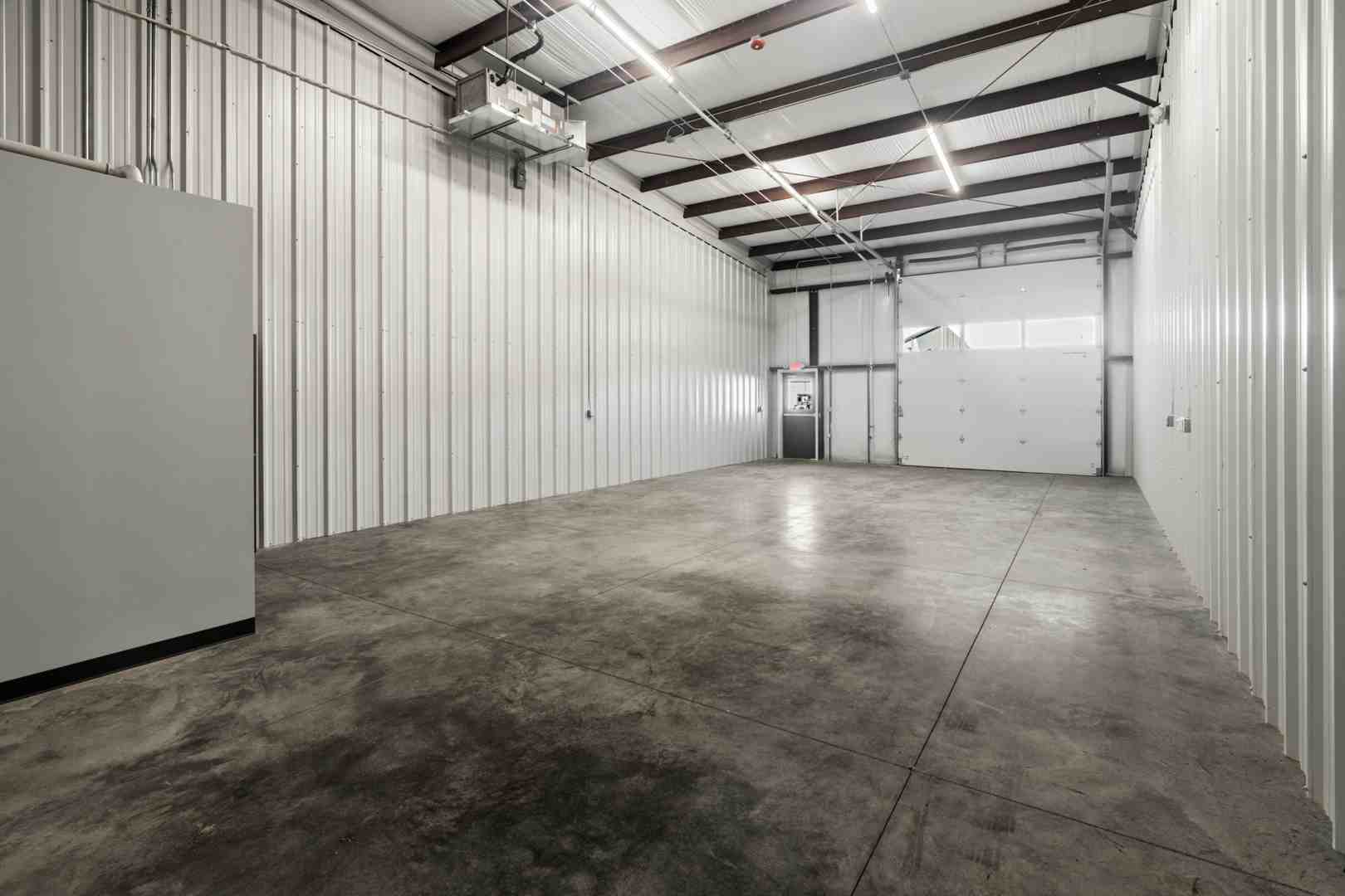 half-empty warehouse with a "For Lease" sign - Microflex Space for Christmas Lighting Businesses