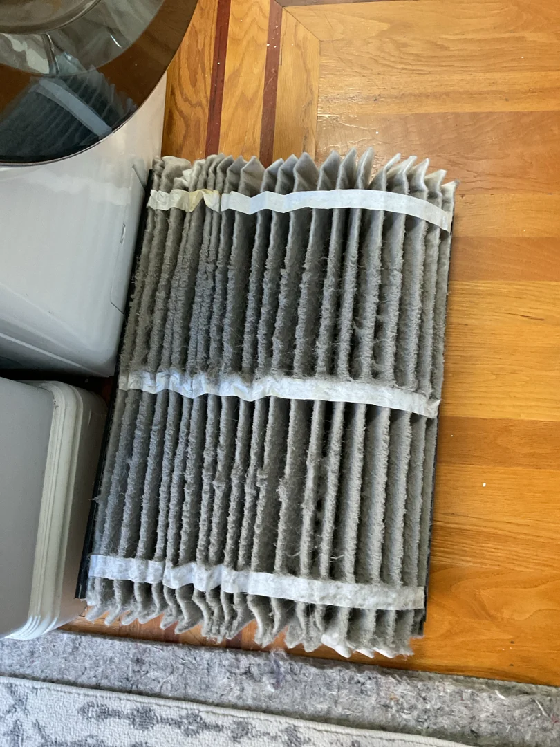 Homeowner in the Bay Area inspecting an outdoor AC unit for debris during spring transition - spring hvac transition from Homeowner in the Bay Area inspecting an outdoor AC unit for debris during spring transition - spring hvac transition from